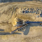 PERENCANAAN TAMBANG BERBASIS PENGURANGAN EMISI UNTUK OPERASI LEBIH AMAN